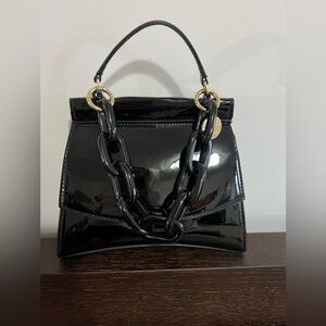 Aldo Black Patent Mini Bag with Gold Accents. Additionally, there is a long belt
